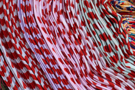 Detailed close up view on samples of cloth and fabrics in different colors found at a fabrics...