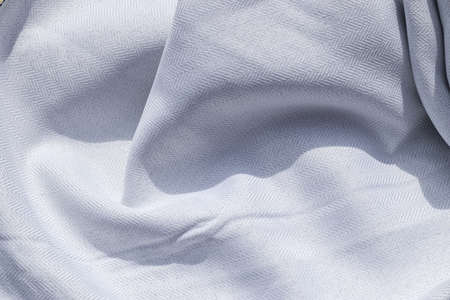 Detailed close up view on samples of cloth and fabrics in different colors found at a fabrics market.の写真素材