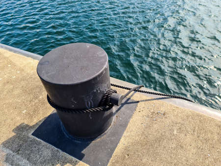 Different bollards in front of the water at the port of kielの写真素材