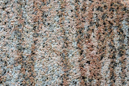 Granite stone wall texture in a detailed close up view in a high resolution.