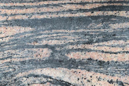 Granite stone wall texture in a detailed close up view in a high resolution.