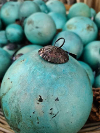 Selective focus of vintage christmas baubles in a close up viewの写真素材