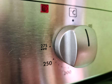 Close-up view of the control panel of a modern stoveの写真素材