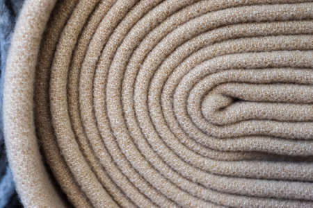 Detailed close up view on samples of cloth and fabrics in different colors found at a fabrics market.の写真素材