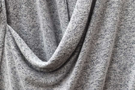 Detailed close up view on samples of cloth and fabrics in different colors found at a fabrics market.の写真素材