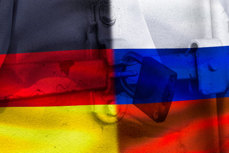A divided flag of Russia and Germany as a symbol of the current conflictの写真素材