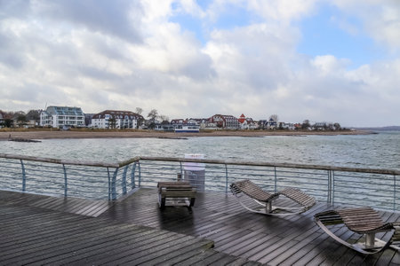 Niendorf, Germany - 30.January 2022: View of the stormy Baltic Sea at a pier in Niendorf on Timmendorfer Strandのeditorial素材