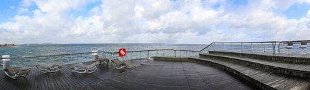 Niendorf, Germany - 30.January 2022: View of the stormy Baltic Sea at a pier in Niendorf on...