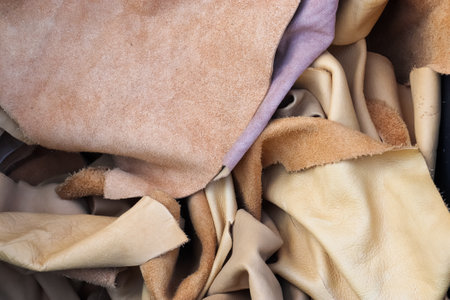 Detailed close up view on samples of cloth and fabrics in different colors found at a fabrics market.の写真素材