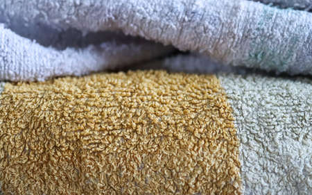 Detailed close up view on samples of cloth and fabrics in different colors found at a fabrics market.の写真素材