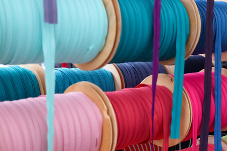 Detailed close up view on samples of cloth and fabrics in different colors found at a fabrics...