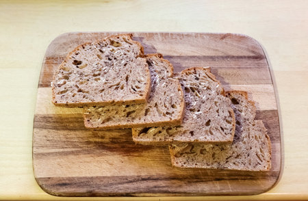 Selective focus view at slices of fresh baked crusty bread