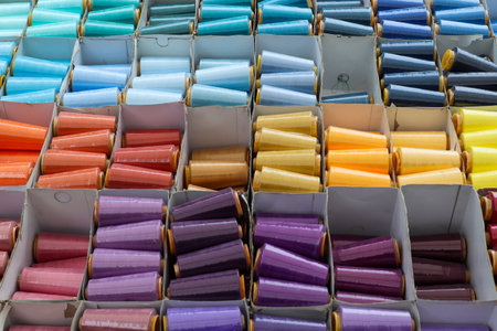 Detailed close up view on samples of cloth and fabrics in different colors found at a fabrics market.の写真素材