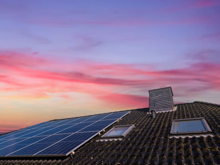 Solar panels producing clean energy on a roof of a residential house