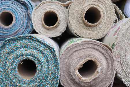 Samples of cloth and fabrics in different colors found at a fabrics market.