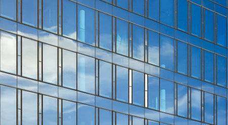 Modern office building facades with glass and reflecting sunlight in the windows