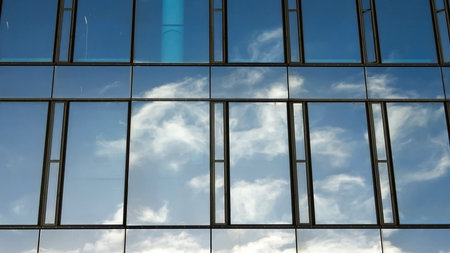 Modern office building facades with glass and reflecting sunlight in the windows