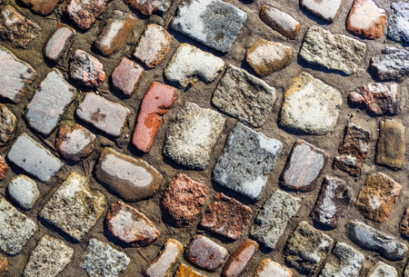 Detailed close up on old historical cobblestone roads and walkways all over europeの写真素材