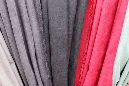View on samples of cloth and fabrics in different colors found at a fabrics market.の写真素材