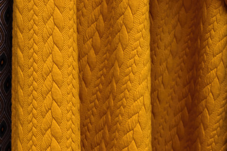 Detailed close up view on samples of cloth and fabrics in different colors found at a fabrics market.の写真素材