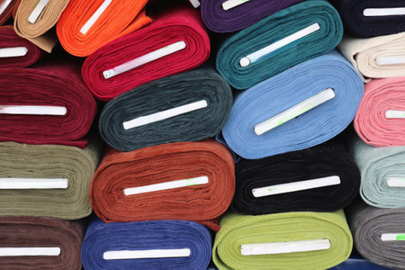 Detailed close up view on samples of cloth and fabrics in different colors found at a fabrics...