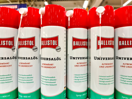 Kiel, Germany - 12 December 2023: A row of cans of Ballistol brand universal oil on a DIY store...