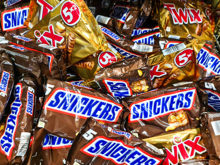 Kiel, Germany - 02. February 2024: Bags of Snickers brand chocolate bars on a supermarket shelfのeditorial素材