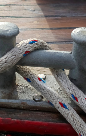 Detailed close up detail of ropes and cordage in the rigging of an old wooden vintage sailboat.