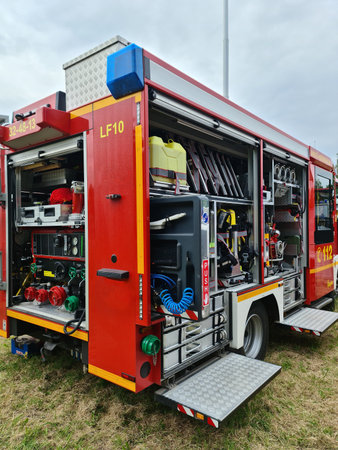 Kiel, Germany - 24.May 2024: Large fire department vehicle with a view of numerous tools for the job