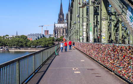 Cologne, Germany - 30. July 2024: The Hohenzollern bridge in Cologne with its thousands of colorful love locksのeditorial素材