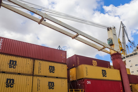 Valletta, Malta: 01. October 2024: A close-up view of a large container ship in the industrial port...