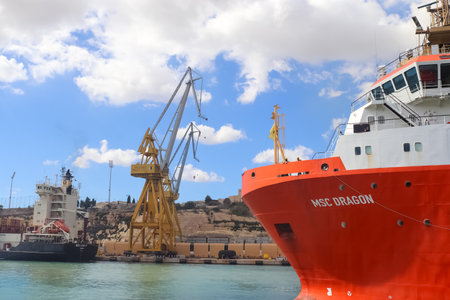 Valletta, Malta: 01. October 2024: A large tugboat named MSC Dragon in the industrial port of Valletta in Maltaのeditorial素材