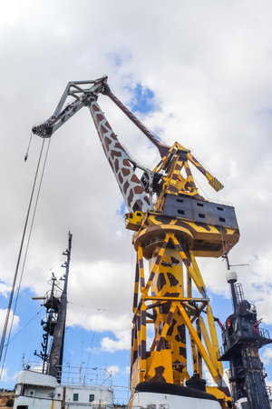 Valletta, Malta: 01. October 2024: The famous crane with the painting of a giraffe at the industrial port of Valletta in Maltaのeditorial素材