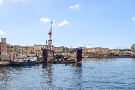 Valletta, Malta: 01. October 2024: Ships and cranes at the docks of the industrial port of Valletta in Maltaのeditorial素材