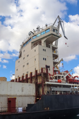 Valletta, Malta: 01. October 2024: A close-up view of a large container ship in the industrial port of Valletta in Maltaのeditorial素材
