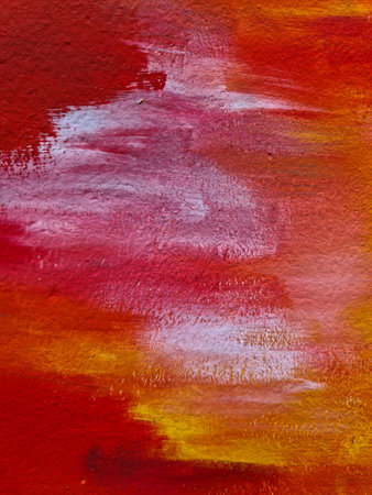 Abstract painting background with textured brushstrokes in red, orange and white, creating a vibrant...