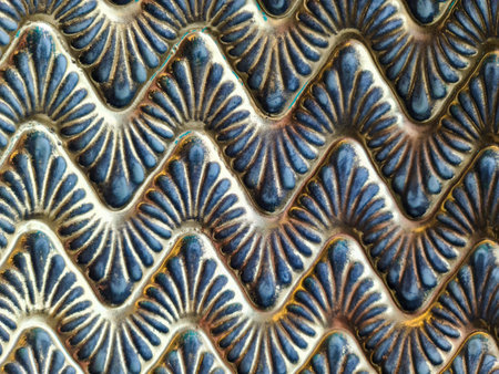 Intricate blue and gold shell pattern creating a visually appealing textured background, perfect for design projects needing a touch of elegance and sophisticationの写真素材