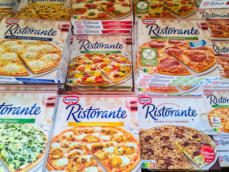 Kiel, Germany - 24. November 2025: Dr. Oetker Ristorante frozen pizza packages filling a supermarket freezer aisle, showcasing varied flavors and branded retail packagingのeditorial素材