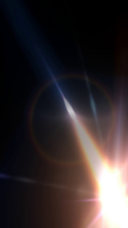 Dynamic light refracting on a dark background with sun flare and glowing elements