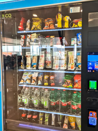 Naples, Italy - 09. March 2026: Vending machine providing quick food and beverage options for...
