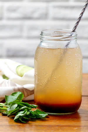 Glass cup with refreshing tamarind juice with mint and ice