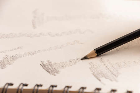 shadows with pencil on a sheet of paper or drawing boardの写真素材