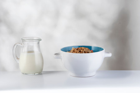 World Milk Day celebration with a small glass jug filled with pure cow's milk The image emphasizes...