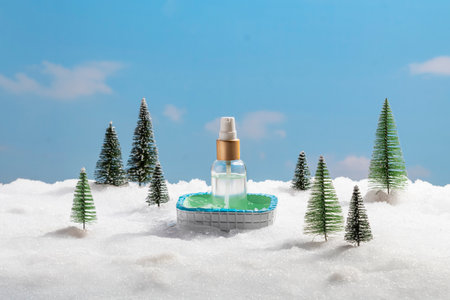 A tiny, inviting pool rests in a blanket of snow, framed by miniature festive pine trees. The detail...