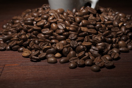 Coffee beans at wooden table