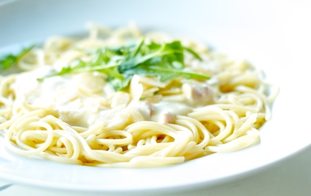Delicious pasta carbonara served in fine restaurantの写真素材
