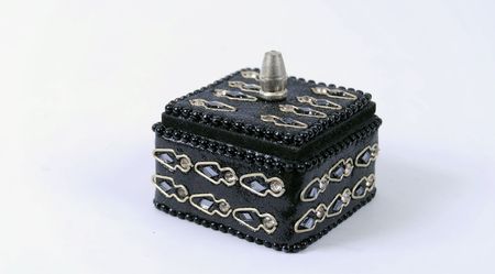 A studio shots of small boxes (various materials) usually used as pill boxes/jars