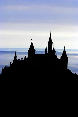 A Silhouette of an ancient German castle in front of a moody skyの写真素材