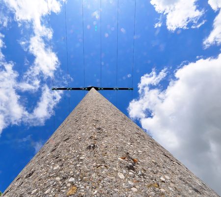 A shot of a power pole against a blue spring skyの写真素材