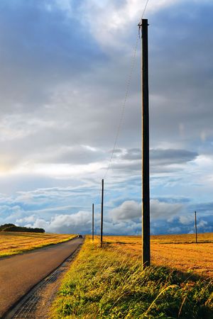 Swabian Alb Landscape with lonely power poles on a September eveningの写真素材